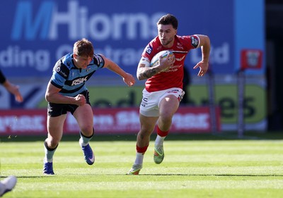 180426 - Scarlets v Cardiff Rugby - United Rugby Championship - Joe Roberts of Scarlets is tackled by Jacob Beetham of Cardiff 
