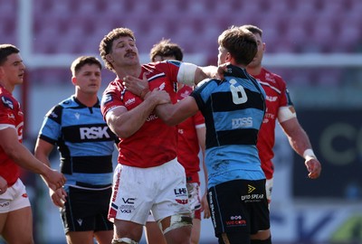 180426 - Scarlets v Cardiff Rugby - United Rugby Championship - Tensions boil over between Fletcher Anderson of Scarlets and Alex Mann of Cardiff 