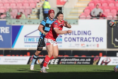 180426 - Scarlets v Cardiff Rugby - United Rugby Championship - Joe Hawkins of Scarlets gets the ball away 