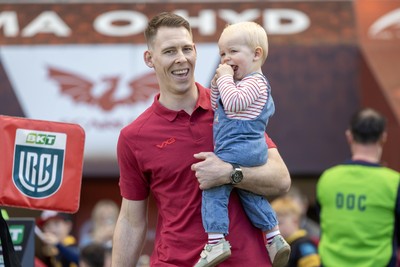 180426 - Scarlets v Cardiff Rugby - United Rugby Championship - Liam Williams walks on the field before kick off with his son