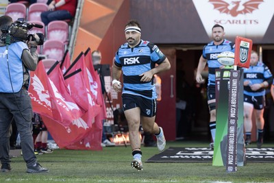 180426 - Scarlets v Cardiff Rugby - United Rugby Championship - Liam Belcher of Cardiff Rugby leads his side out 
