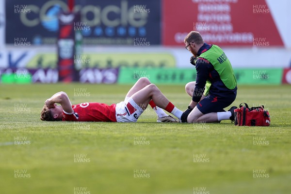 180426 - Scarlets v Cardiff Rugby - United Rugby Championship - Ellis Mee of Scarlets goes down injured