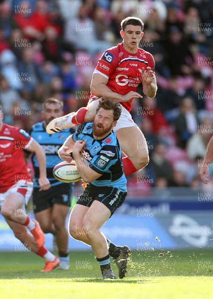 180426 - Scarlets v Cardiff Rugby - United Rugby Championship - Joe Hawkins of Scarlets collides with Rory Jennings of Cardiff in the air