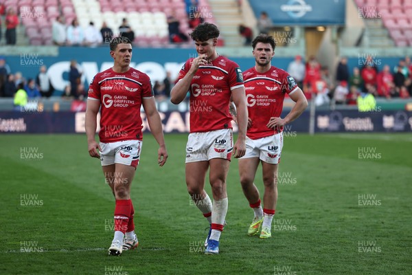 180426 - Scarlets v Cardiff Rugby - United Rugby Championship - Joe Hawkins, Eddie James and Joe Roberts at the final whistle 