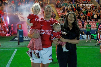 260926 - Scarlets v Cardiff Rugby - United Rugby Championship - Ryan Elias of Scarlets comes out onto the pitch with his wife and children on his 250th appearance for the Scarlets