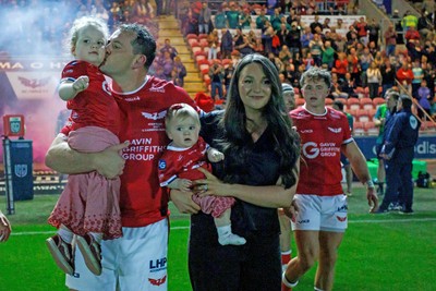 260926 - Scarlets v Cardiff Rugby - United Rugby Championship - Ryan Elias of Scarlets comes out onto the pitch with his wife and children on his 250th appearance for the Scarlets