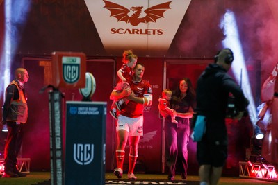 260926 - Scarlets v Cardiff Rugby - United Rugby Championship - Ryan Elias of Scarlets comes out onto the pitch with his wife and children on his 250th appearance for the Scarlets