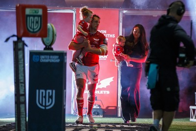 260926 - Scarlets v Cardiff Rugby - United Rugby Championship - Ryan Elias of Scarlets comes out onto the pitch with his wife and children on his 250th appearance for the Scarlets