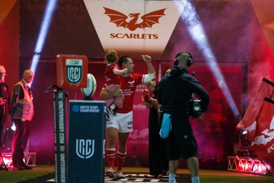 260926 - Scarlets v Cardiff Rugby - United Rugby Championship - Ryan Elias of Scarlets comes out onto the pitch with his wife and children on his 250th appearance for the Scarlets