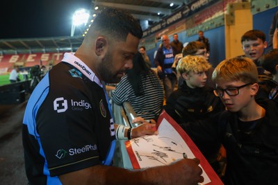 260926 - Scarlets v Cardiff Rugby - United Rugby Championship - Scott Sio of Cardiff sign autographs for fans after the game