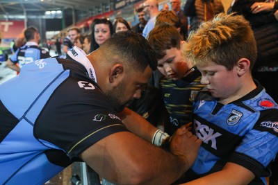 260926 - Scarlets v Cardiff Rugby - United Rugby Championship - Scott Sio of Cardiff sign autographs for fans after the game