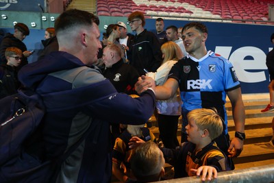 260926 - Scarlets v Cardiff Rugby - United Rugby Championship - Alex Mann of Cardiff with fans at the end of the match