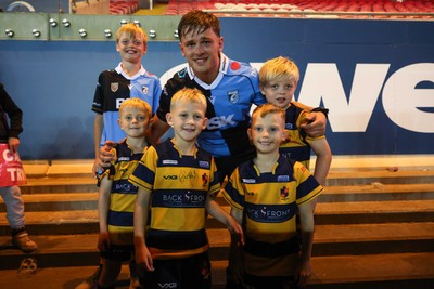 260926 - Scarlets v Cardiff Rugby - United Rugby Championship - Alex Mann of Cardiff with fans from Aberdare RFC at the end of the match