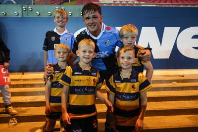 260926 - Scarlets v Cardiff Rugby - United Rugby Championship - Alex Mann of Cardiff with fans from Aberdare RFC at the end of the match