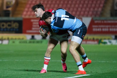 260926 - Scarlets v Cardiff Rugby - United Rugby Championship - Mason Grady of Cardiff tackles Joe Roberts of Scarlets