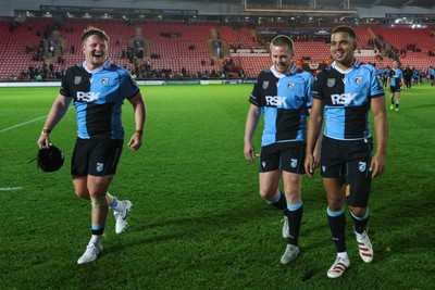 260926 - Scarlets v Cardiff Rugby - United Rugby Championship - Efan Lloyd, Dan Thomas and Ben Thomas of Cardiff at the end of the match