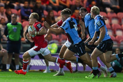 260926 - Scarlets v Cardiff Rugby - United Rugby Championship - Blair Murray of Scarlets makes a break on his way to scoring a try