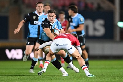 260926 - Scarlets v Cardiff Rugby - United Rugby Championship - Taine Basham of Cardiff Rugby is challenged by Ellis Mee of Scarlets