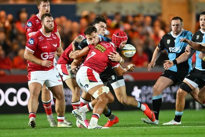 260926 - Scarlets v Cardiff Rugby - United Rugby Championship - Mason Grady of Cardiff Rugby is challenged by Josh Maceloed of Scarlets