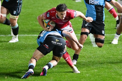 260926 - Scarlets v Cardiff Rugby - United Rugby Championship - Eddie James of Scarlets is challenged by Jarrod Evans of Cardiff Rugby
