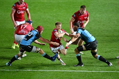 260926 - Scarlets v Cardiff Rugby - United Rugby Championship - Archie Hughes of Scarlets is challenged by James Botham of Cardiff Rugby