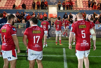 260926 - Scarlets v Cardiff Rugby - United Rugby Championship - Scarlets players applaud fans at full time