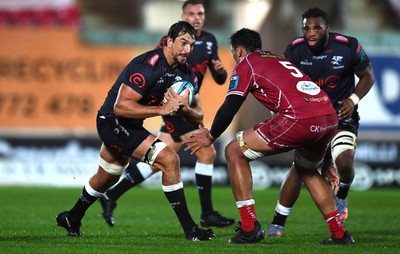 250323 - Scarlets v Sharks - United Rugby Championship - Eben Etzebeth of Sharks is tackled by Sam Lousi of Scarlets