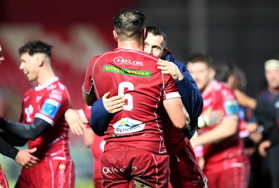 250323 - Scarlets v Sharks - United Rugby Championship - Josh Macleod and Gareth Davies of Scarlets celebrates win