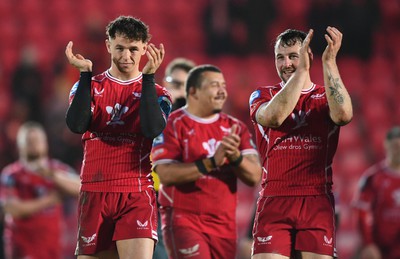 250323 - Scarlets v Sharks - United Rugby Championship - Ryan Conbeer and Tom Rogers of Scarlets celebrates win