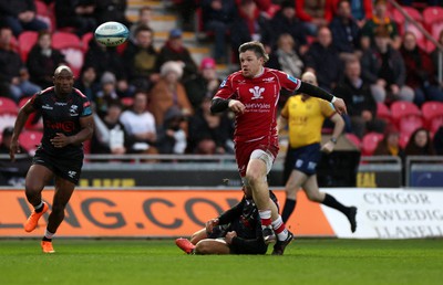 250323 - Scarlets v Cell C Sharks - United Rugby Championship - Steff Evans of Scarlets kicks the ball to go on and score a try