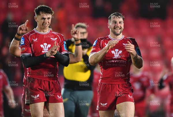 250323 - Scarlets v Sharks - United Rugby Championship - Ryan Conbeer and Tom Rogers of Scarlets celebrates win