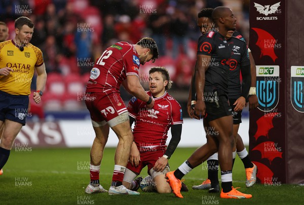 250323 - Scarlets v Cell C Sharks - United Rugby Championship - Steff Evans of Scarlets celebrates scoring a try with team mates