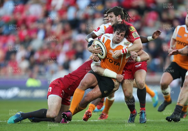 050518 - Scarlets v Cheetahs, Guinness PRO14 - Francois Venter of Cheetahs is held by Hadleigh Parkes of Scarlets and Dan Jones of Scarlets