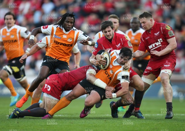 050518 - Scarlets v Cheetahs, Guinness PRO14 - Francois Venter of Cheetahs is held by Hadleigh Parkes of Scarlets and Dan Jones of Scarlets