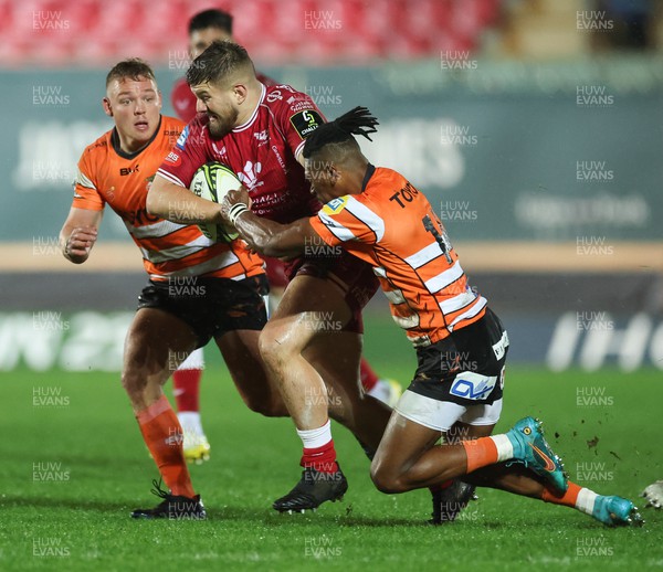 130123 - Scarlets v Toyota Cheetahs, ECPR Challenge Cup - Shaun Evans of Scarlets is tackled