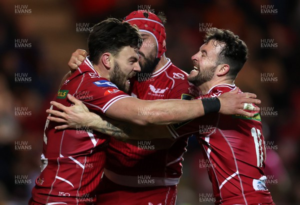 070423 - Scarlets v Clermont Auvergne - European Challenge Cup quarter-final - Johnny Williams of Scarlets celebrates scoring a try with Josh Macleod and Ryan Conbeer