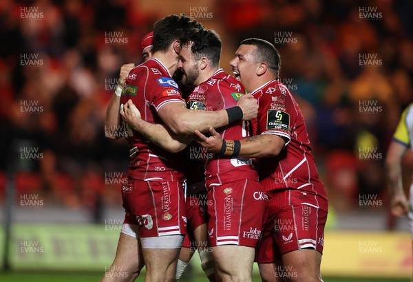 070423 - Scarlets v Clermont Auvergne - European Challenge Cup quarter-final - Johnny Williams of Scarlets celebrates scoring a try with team mates