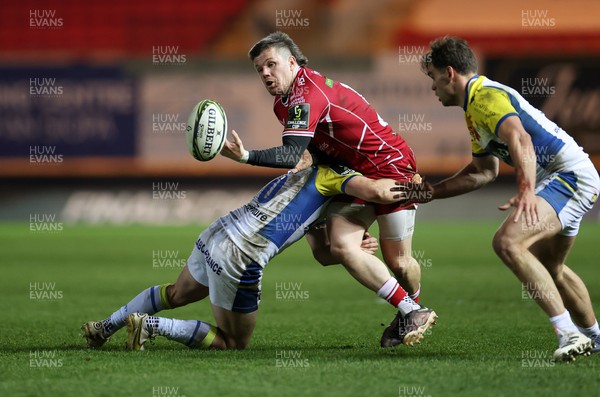 070423 - Scarlets v Clermont Auvergne - European Challenge Cup quarter-final - Steff Evans of Scarlets is tackled by Anthony Belleau of Clermont