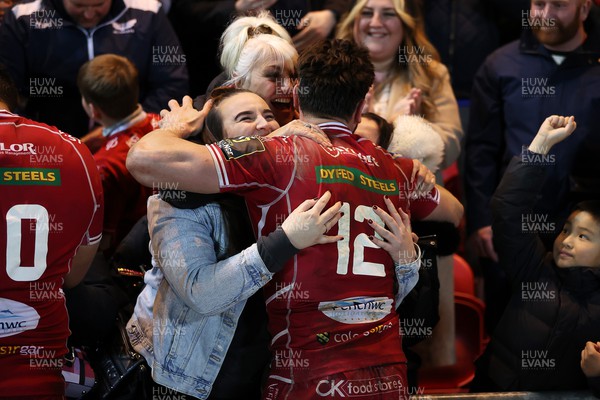 070423 - Scarlets v Clermont Auvergne - European Challenge Cup quarter-final - Johnny Williams of Scarlets celebrate with family at full time