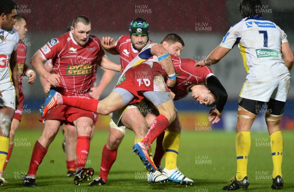 141213 - Scarlets v Clermont Auvergne - Heineken Cup -Liam Williams of Scarlets is tackled by Benjamin Kayser of Clermont Auvergne