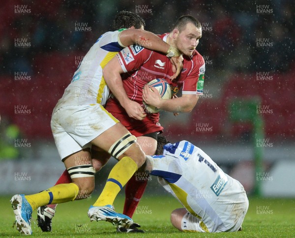 141213 - Scarlets v Clermont Auvergne - Heineken Cup -Ken Owens of Scarlets is tackled by Julien Bardy and Thomas Domingo of Clermont Auvergne