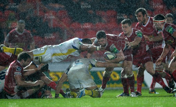 141213 - Scarlets v Clermont Auvergne - Heineken Cup -Rob McCusker of Scarlets is tackled by Damien Chouly of Clermont Auvergne