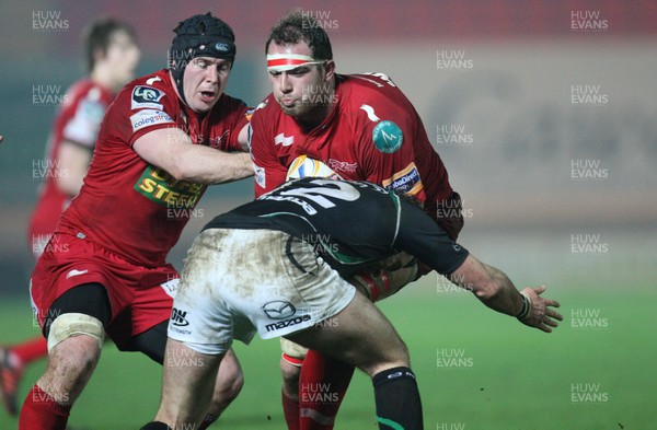 020312 - Scarlets v Connacht, RaboDirect PRO12 - Scarlets Lou Reed drives through Connacht's David McSharry 