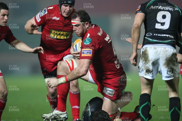 020312 - Scarlets v Connacht, RaboDirect PRO12 - Scarlets Lou Reed drives through Connacht's David McSharry 