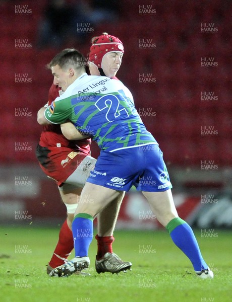 080213 - Scarlets v Connacht - Rabo Direct Pro12 -   Scarlets' Kieran Murphy, is tackled by Connacht's Paul O'Donohoe 