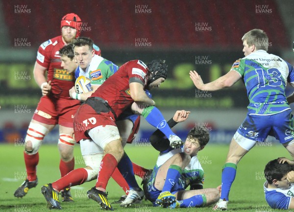 080213 - Scarlets v Connacht - Rabo Direct Pro12 -   Connacht's Paul O'Donohoe, centre, is tackled by Scarlets' Emyr Phillips 