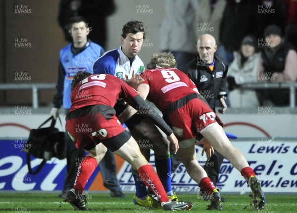 080213 - Scarlets v Connacht - Rabo Direct Pro12 -   Connacht's Tiernan O'Halloran is tackled by Scarlets' Nic Reynolds and Aled Davies