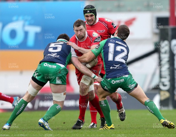 100116 - Scarlets v Connacht - Guinness PRO12 - Morgan Allen of Scarlets is tackled by Andrew Browne and Craig Ronaldson of Connacht