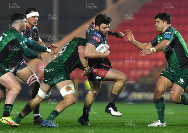 190222 - Scarlets v Connacht - United Rugby Championship - Johnny Williams of Scarlets is tackled by Cian Prendergast of Connacht