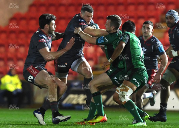 190222 - Scarlets v Connacht - United Rugby Championship - Scott Williams of Scarlets is tackled by Jack Carty of Connacht